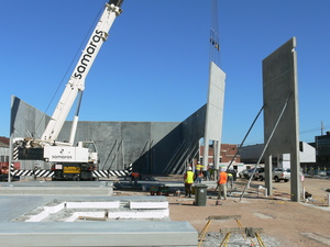 Crane setting up precast concrete
